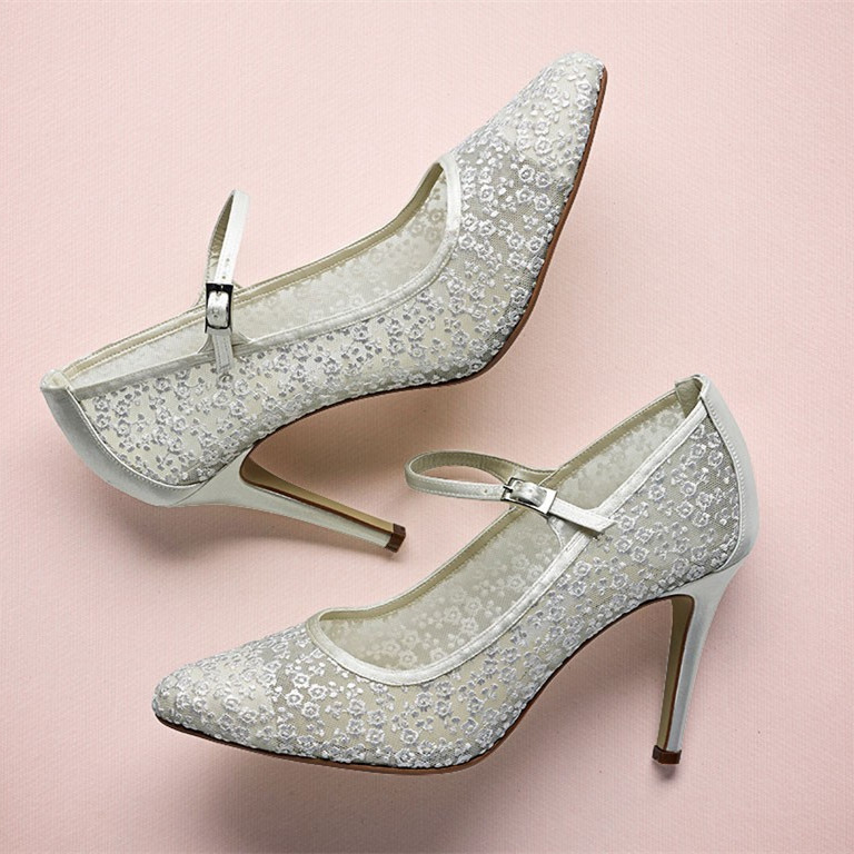 5ab8fb052469e3ef312a5af23b3e8f29.jpeg White Lace Stiletto Heel Mary Jane Pumps - Image 1