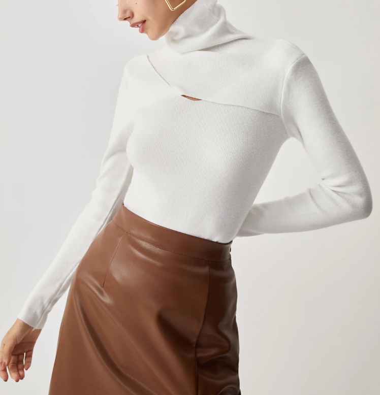 7f7c9306dddfe07a42639264b494e596.jpeg Criss Cross Turtleneck Long Sleeve Knit Top - Image 1